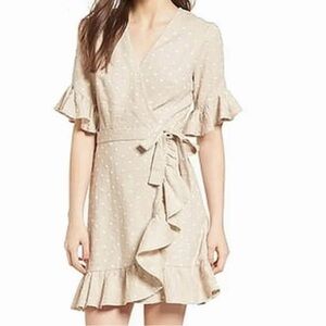 Wayf linen tans & white polka dot true wrap dress with ruffle sleeves and hem